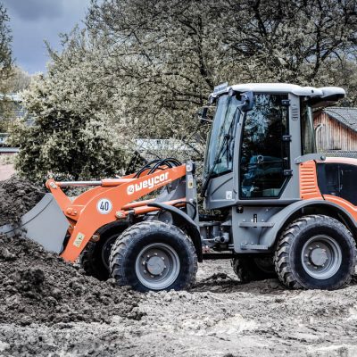 Weycor Radlader AR 520 im Erdbewegungseinsatz auf Baustelle.