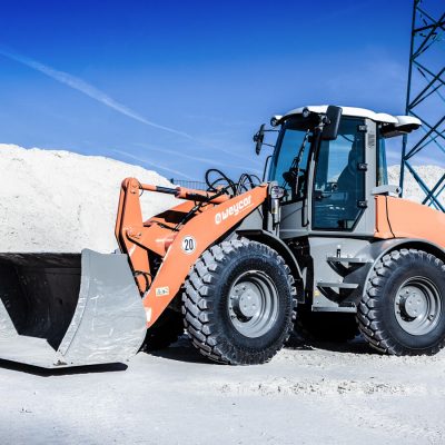 Weycor AR 580 wheel loader on a construction site with light-colored bulk material.